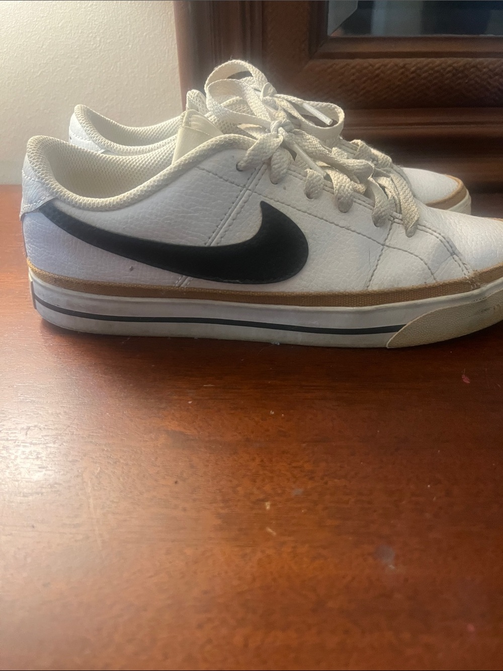 Nike White Sneakers with Black Swoosh and Tan Accent